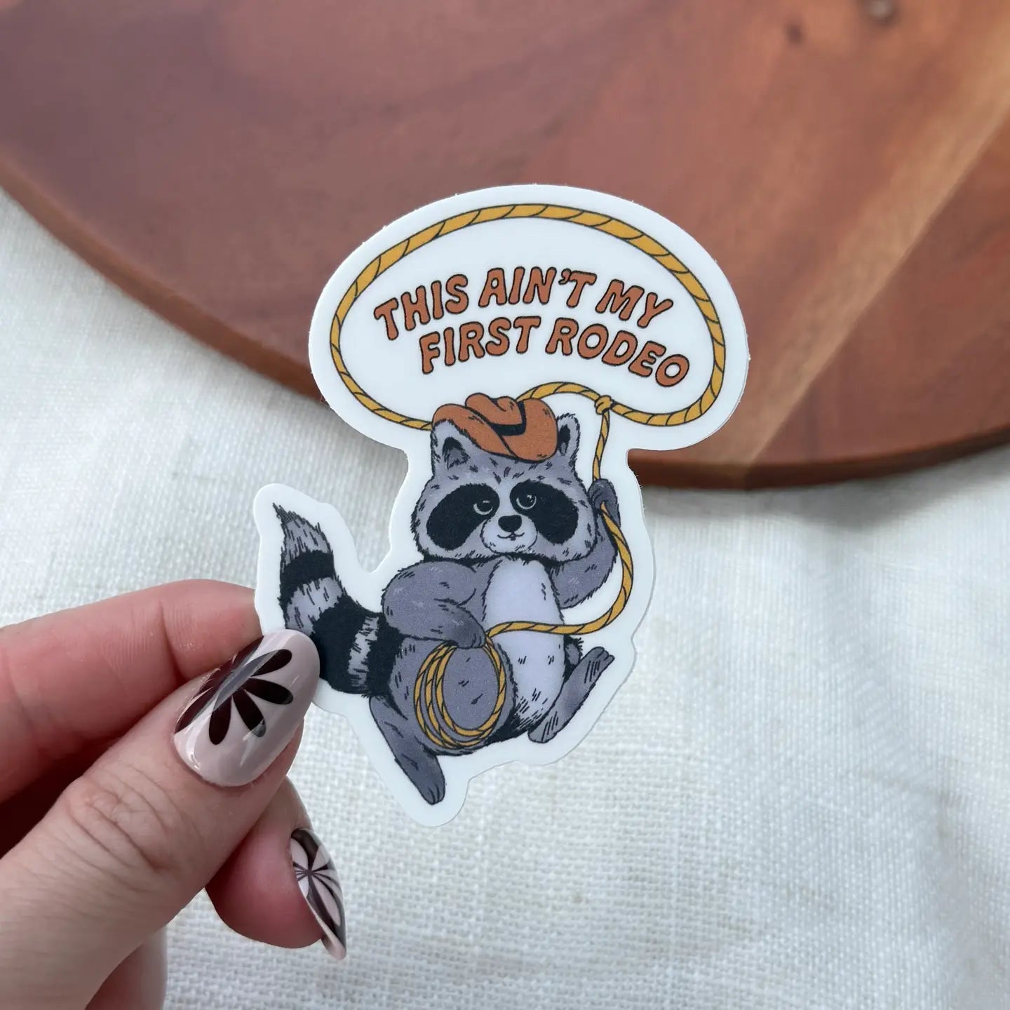 This Ain't My First Rodeo Cowboy Raccoon Lasso Sticker