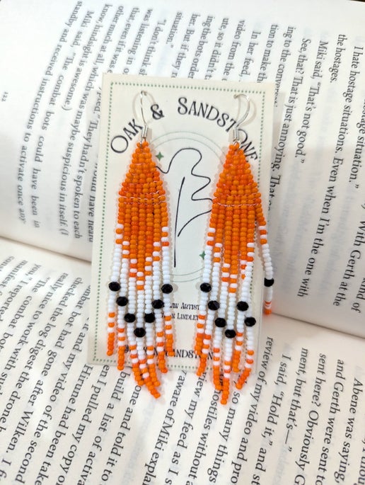 Orange power dangle earrings